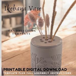 May include: Printable digital download template for handbuilding a grey ceramic vase with a floral design. The vase has multiple holes in the top for flower stems. The template includes assembly instructions. "Ikebana Vase" and "Handbuilding Template" are written in black text on the image.
