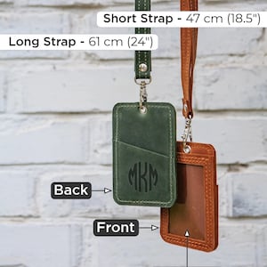 May include: Two leather ID badge holders with straps. The green holder has a monogram "MKM" on the front and a pocket on the back. The brown holder has a clear plastic window on the front. The straps are 47 cm (18.5 inches) and 61 cm (24 inches) long.