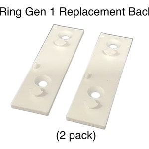 May include: Two white plastic replacement back plates for a Ring Gen 1 doorbell. (2 pack)