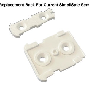 May include: Two white plastic replacement parts for a SimpliSafe sensor. The larger part has two holes and the smaller part has three holes.