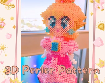 May include: A 3D Perler bead pattern of Princess Peach from the Super Mario Bros. video game series. The pattern is made with pink, peach, blue, and white beads. The pattern is titled "3D Perler Pattern".
