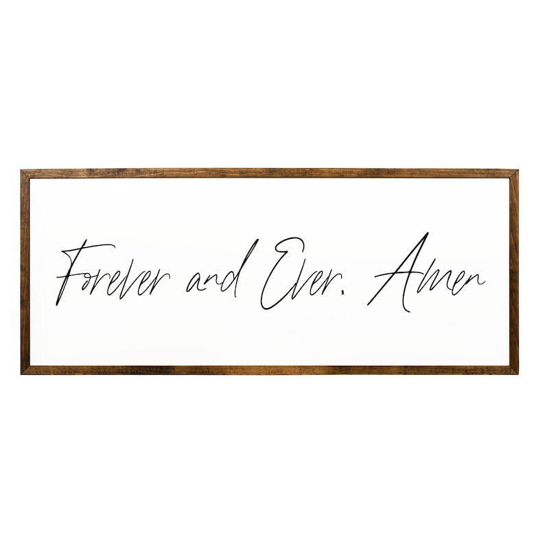 May include: A framed wood sign with the text "Forever and Ever. Amen" in black cursive script on a white background.