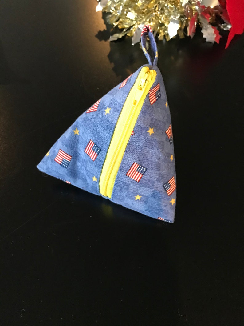 Triangle pyramid zipper pouch for coins earphones chargers etc; no raw edges exposed inside