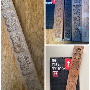 May include: Five wooden cookie cutters with various designs, including a windmill, a bird, a squirrel, a person, and a house. The cutters are arranged in a row on a wooden surface. The cutters are all made of wood and have a natural finish.