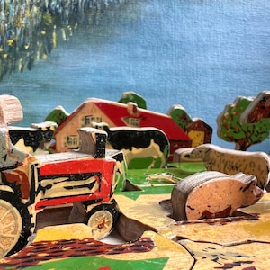 May include: A wooden toy farm set with a red tractor, a farmhouse, a cow, a pig, a sheep, and a horse. The set is painted in bright colors and has a rustic charm.
