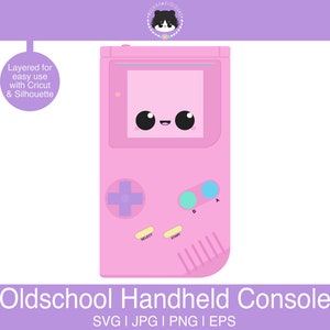 May include: A pink handheld video game console with a cute cartoon face. The console has a screen, buttons, and a directional pad. The text "SELECT" and "START" are visible on the console.