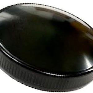 May include: A black plastic bottle cap with a ribbed edge.