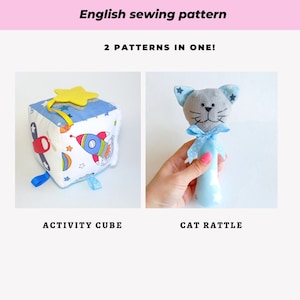 May include: Two sewing patterns for a baby activity cube and a cat rattle. The cube is blue and white with a rocket, aeroplane, and stars. The rattle is blue and grey with a cat face and a white bow.