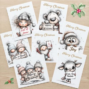 May include: A collection of six white Christmas greeting cards featuring whimsical illustrations of characters including a child, a bear, gnomes, an owl, and a reindeer, each holding a sign with holiday text like Let it snow, Joy, and Merry Christmas.