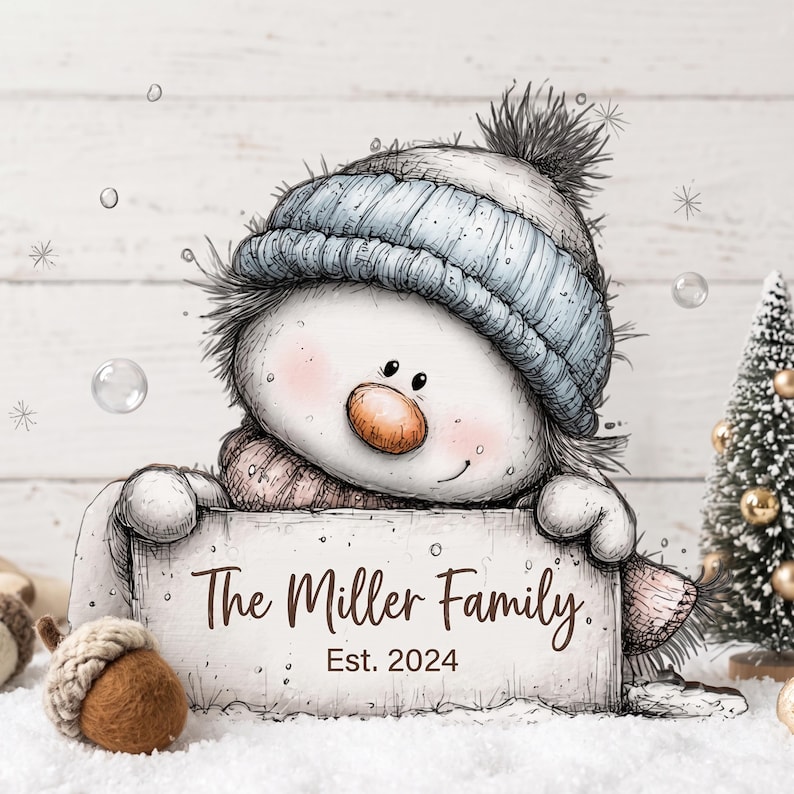 May include: A whimsical illustration of a snowman wearing a light blue knit hat and scarf, holding a rectangular sign that reads The Miller Family Est. 2024. The snowman has a round orange nose and rosy cheeks, rendered in a sketch-like artistic style.