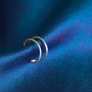 Double hooped ear cuff in fine Sterling Silver. Contemporary, minimalist, sleek! No piercing needed!