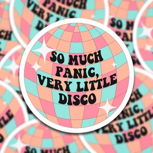 May include: A sticker with a disco ball design and the text "So much panic, very little disco" in black letters on a pink and blue background.