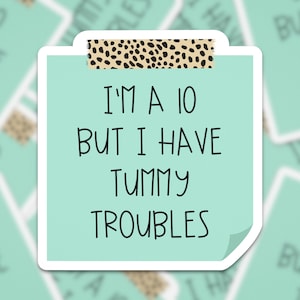 May include: A light green sticker with a leopard print tape border. The sticker has the text "I'm a 10 but I have tummy troubles" written in black.