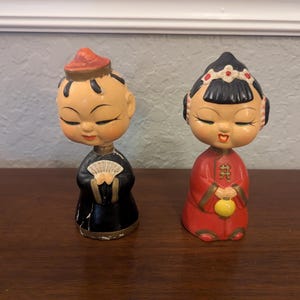 Vintage pair of Asian Nodder/Bobblehead figures