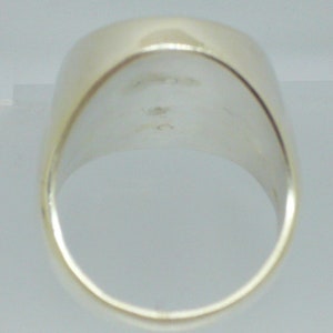 May include: The inside of a silver ring with a smooth, polished finish.