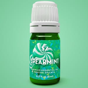 May include: A green glass bottle of SZ Essentials Spearmint Premium Essential Oil. The label features a swirl design and the text "SPEARMINT". The bottle contains 0.17 fl. oz. (5 ml) of oil and has a white cap.