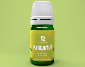 May include: A green glass essential oil bottle with a white cap. The label reads "SZ Essentials BERGAMOT Creativity Booster" with a lime illustration. The bottle contains 0.17 fl. oz. (5 ml) of product.