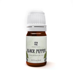 May include: A brown glass bottle with a white cap, labeled "SZ ESSENTIALS. BLACK PEPPER PURE ESSENTIAL OIL 0.17 fl. oz. (5 ml)".