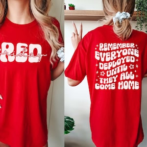 May include: Red Friday t-shirt with a white graphic that says "RED friday" on the front and "Remember everyone deployed until they all come home" on the back.