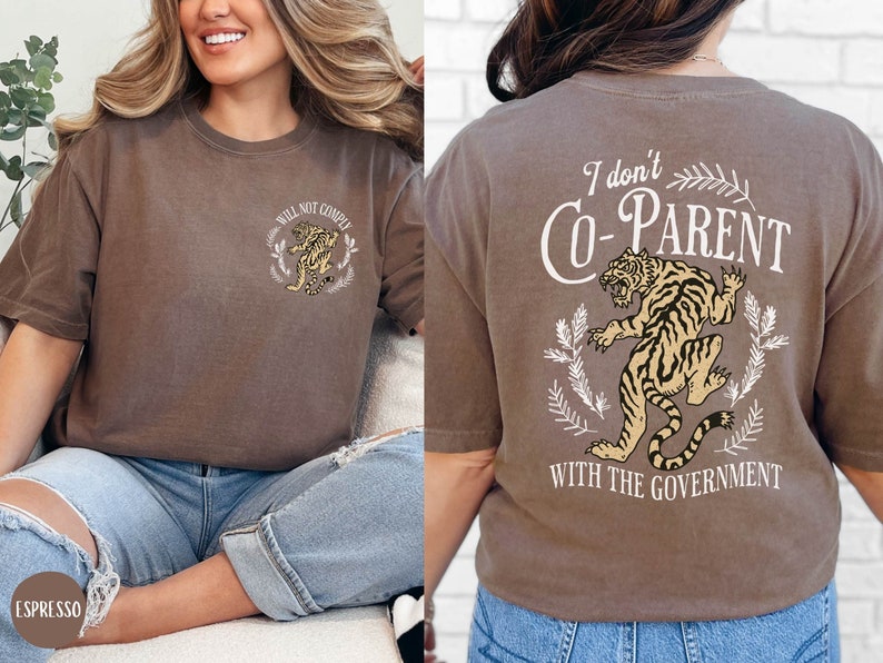 May include: Brown t-shirt with a tiger graphic and the text "I don't Co-Parent with the Government".