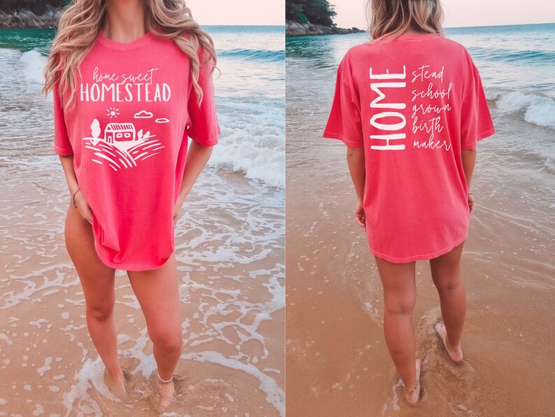May include: A pink t-shirt with the text "home sweet homestead" on the front and "HOME stead school grown birth maker" on the back.