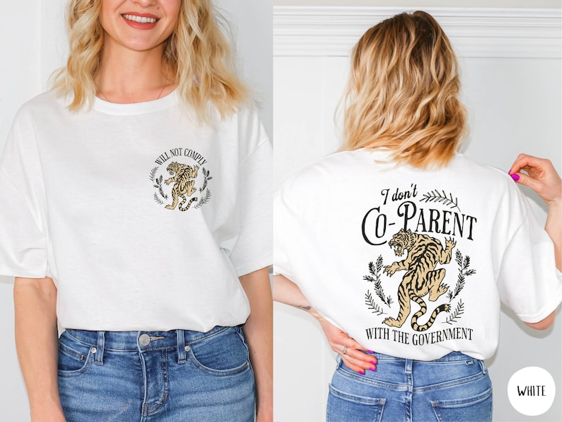 May include: White t-shirt with a tiger graphic and the text "Will Not Comply". The back of the shirt has a tiger graphic and the text "I don't Co-Parent with the Government".