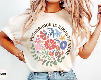 Comfort Colors® Motherhood is Kingdom Work Shirt, Praying Mama Faithful Bible Shirt, Boho Floral Wildflower Christian Retro Bible Study Tee