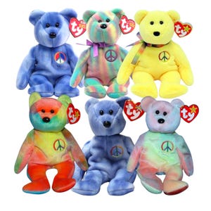 May include: A collection of six colorful plush teddy bears. Each bear features a peace sign and a Ty heart-shaped tag. The bears are in various colors, including blue, yellow, and tie-dye patterns. They are soft and cuddly.