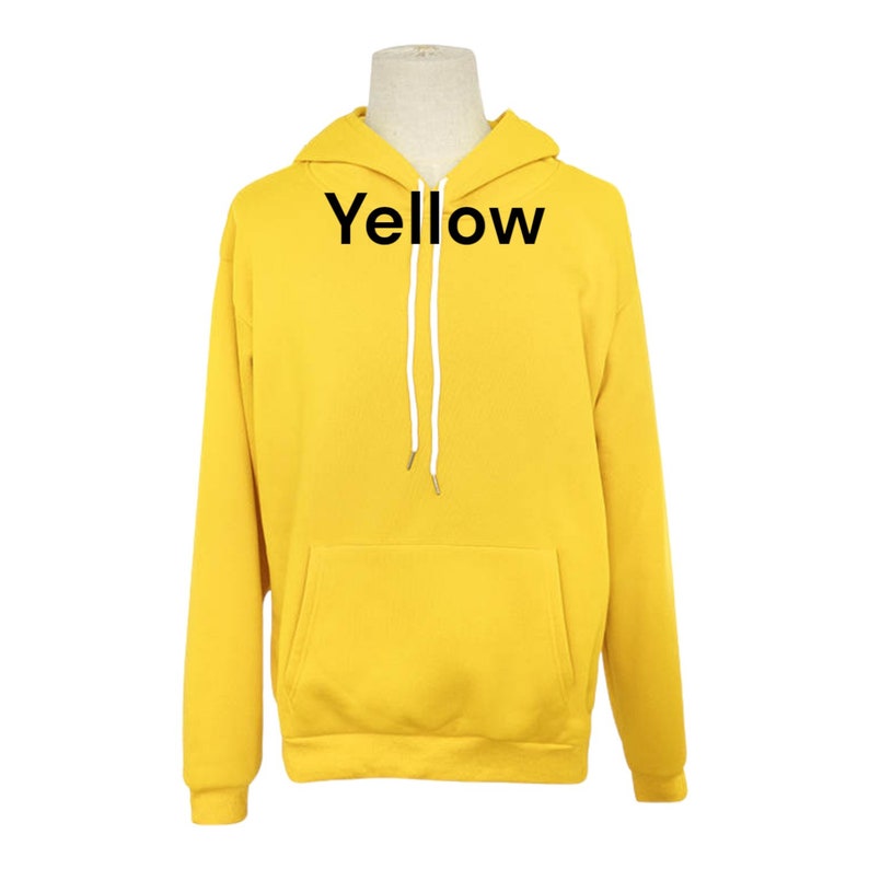 May include: A yellow hooded sweatshirt with the word "Yellow" printed on the front.