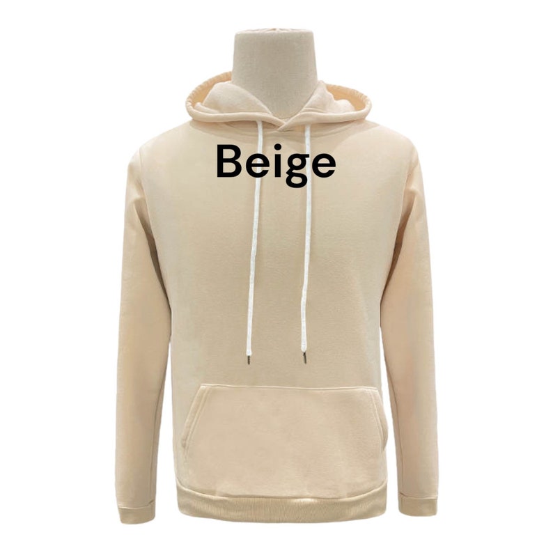 May include: Beige hooded sweatshirt with a kangaroo pocket and white drawstrings.
