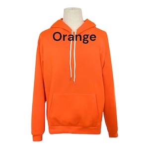 May include: Orange hoodie with a white drawstring. The hoodie has a kangaroo pocket.