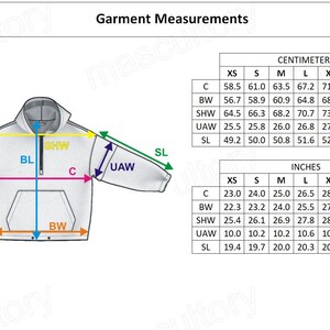 May include: White hoodie with garment measurements in inches and centimeters. The diagram shows the dimensions of the hoodie, including chest, body width, shoulder width, underarm width, and sleeve length. The text "Garment Measurements" is at the top.