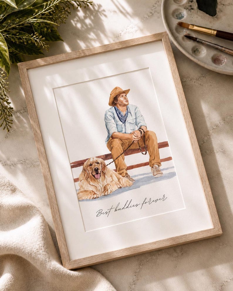 May include: A framed watercolor illustration featuring a person wearing a tan hat, light blue shirt, and brown pants sitting on a bench with a golden retriever on a leash. The text "Best buddies forever" is written in cursive at the bottom.