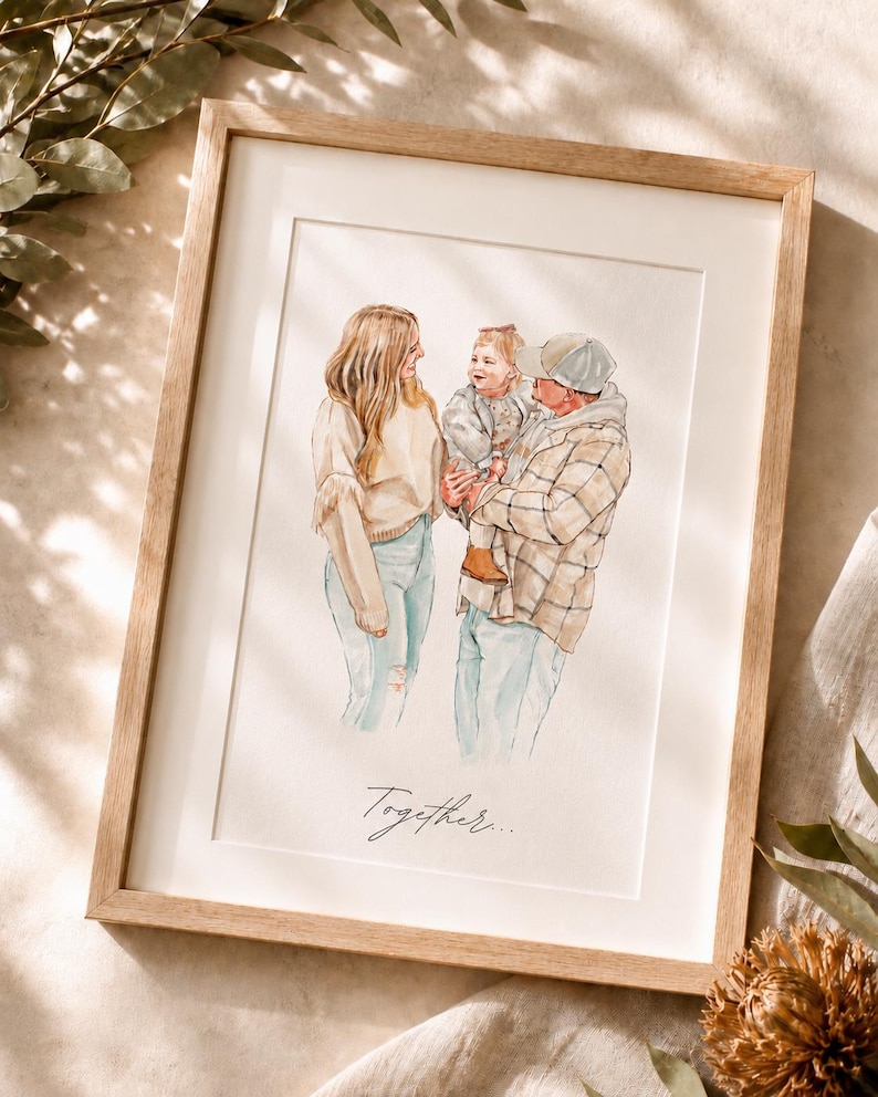 May include: A framed watercolor illustration depicting a family of three. A person with long blonde hair stands next to another person wearing a plaid shirt and baseball cap, who holds a small child. The word Together is written in cursive below.