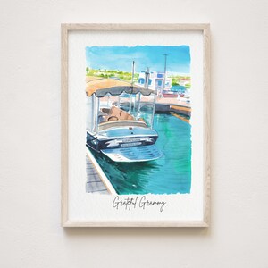 May include: Watercolor painting of a boat docked at a marina. The boat is blue and white with a white canopy. The water is a bright turquoise blue. The text "Grateful Grammy" is written in black at the bottom of the image.