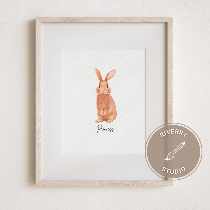 May include: A watercolour painting of a brown rabbit with pink ears and nose. The rabbit is standing on its hind legs and looking at the viewer. The painting is framed in a light wood frame and has the word "Princess" written below the rabbit.