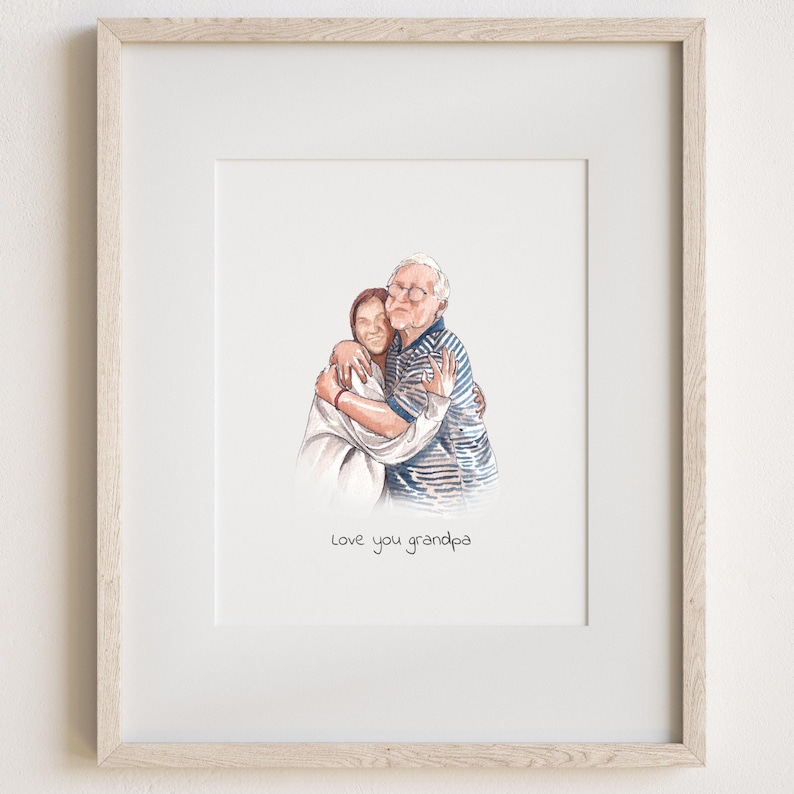 May include: A framed watercolor-style illustration of a person hugging an older person wearing glasses and a blue striped shirt. The illustration is centered on a white background with the text "Love you grandpa" printed in black below the figures.