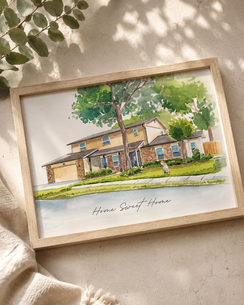 May include: Watercolor painting of a two-story house with a light brown wooden frame. The house has a beige exterior, a dark roof, and a green lawn. The text "Home Sweet Home" is written in cursive below the house.