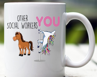 May include: White ceramic mug with a pink and black graphic. The graphic shows a horse on the left and a unicorn on the right. The text "Other Social Workers" is on the left and "YOU" is on the right.