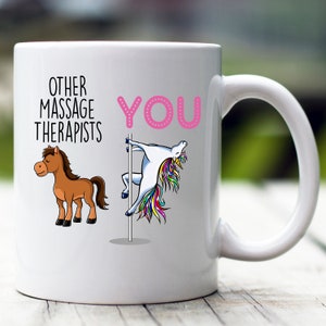 May include: White ceramic mug with a pink unicorn holding a pole and the text "OTHER MASSAGE THERAPISTS YOU" printed on it. A brown horse is on the left side of the mug.