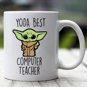 May include: White ceramic mug with a green cartoon character and the text "YODA BEST COMPUTER TEACHER".
