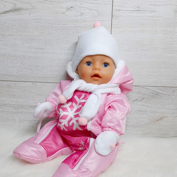 Peach jumpsuits with zippers for BabyBorn dolls 17 inch (43cm). Peach onesies in snowflake print. One-piece dolls snowsuit with furry hood.