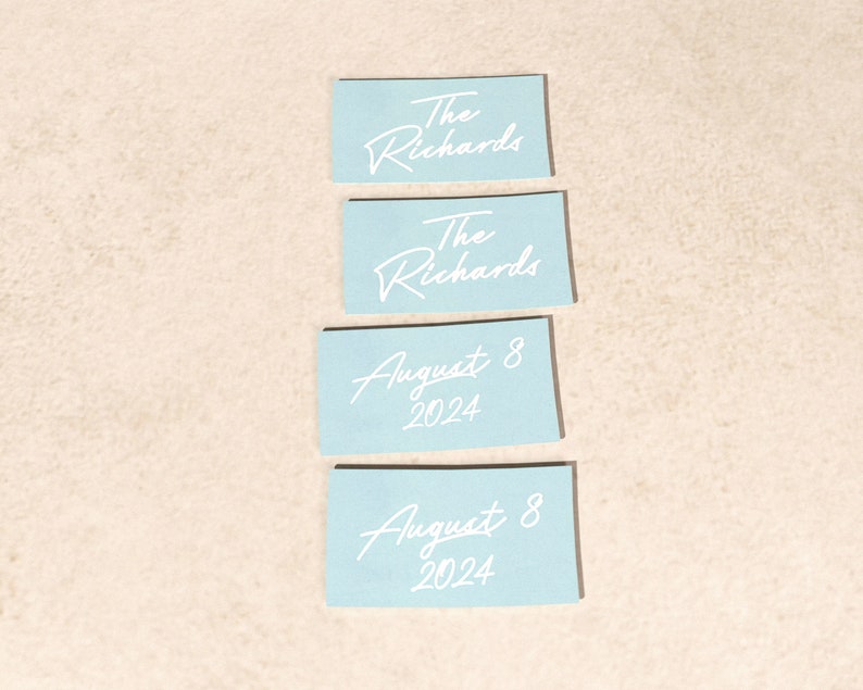 May include: Four light blue cards with white text. The top two cards say "The Richards". The bottom two cards say "August 8, 2024".