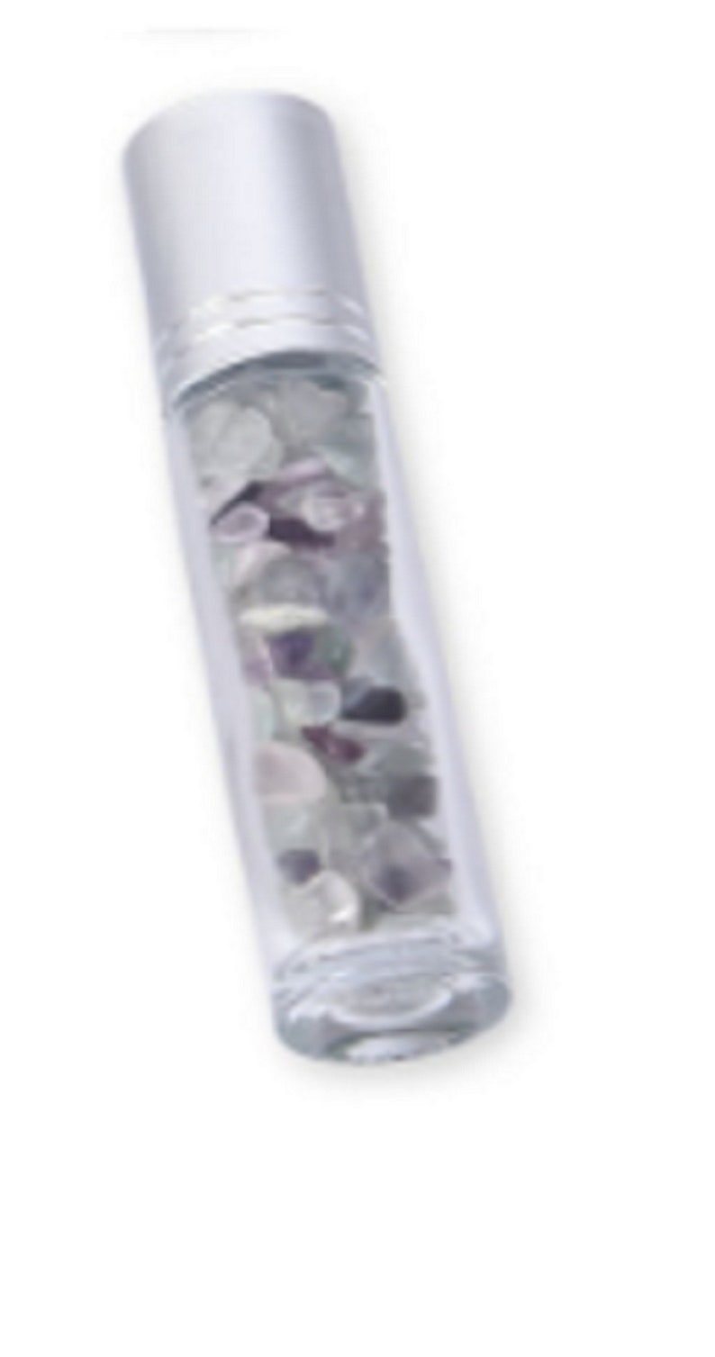 May include: A clear glass roller bottle with a silver cap filled with small, colorful crystals. The crystals are a mix of white, purple, and green.