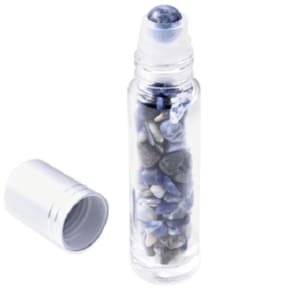 May include: A clear glass roller bottle filled with blue and gray stones, with a silver cap and a blue stone roller ball.