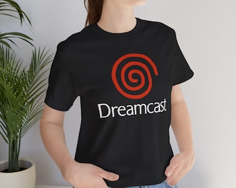 May include: Black t-shirt with a red Dreamcast logo and the word "Dreamcast" in white text.