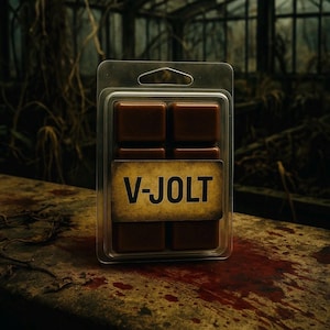 May include: A clear plastic pack containing six brown wax melts. A label with the text "V-JOLT" is centered on the pack. The pack is on a weathered, blood-stained surface, with a blurred, dark background.