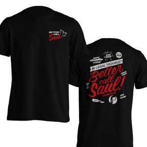May include: Black t-shirt with a red and white graphic design featuring the text "Better Call Saul" and a cartoon image of a lawyer. The back of the shirt has a similar design with additional text and images.