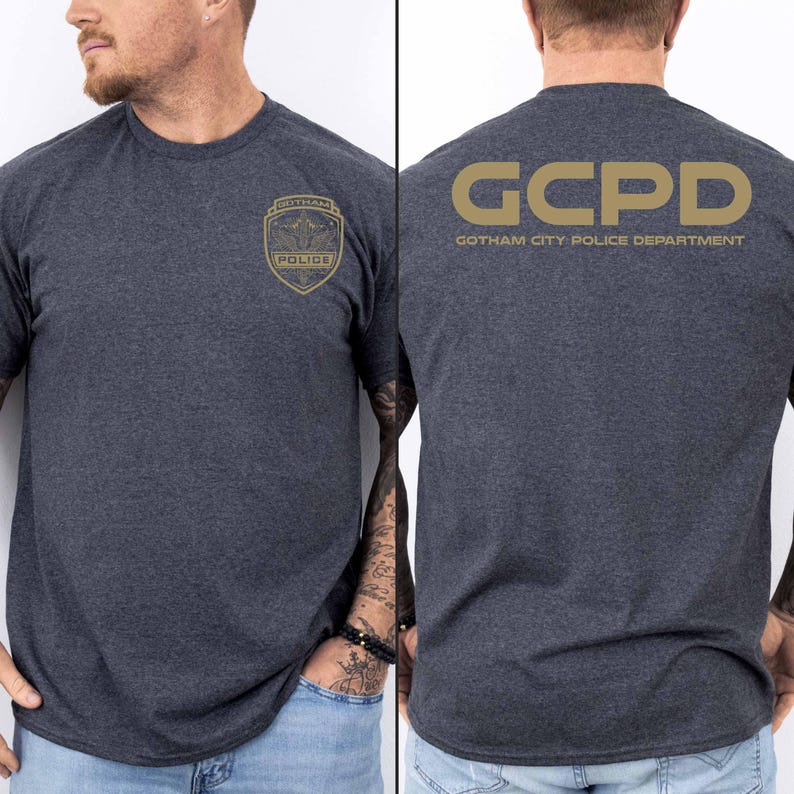 May include: A dark heather grey t-shirt with a gold GCPD Gotham City Police Department logo on the back and a gold Gotham Police badge on the front.