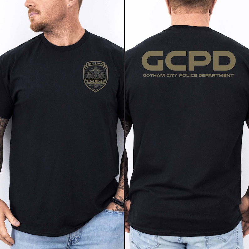 May include: Black t-shirt with a gold graphic of a Gotham City Police Department badge on the front and "GCPD GOTHAM CITY POLICE DEPARTMENT" on the back.